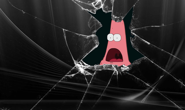 Layar pecah dengan lubang besar, menampilkan wajah karakter Patrick Star dari kartun.
